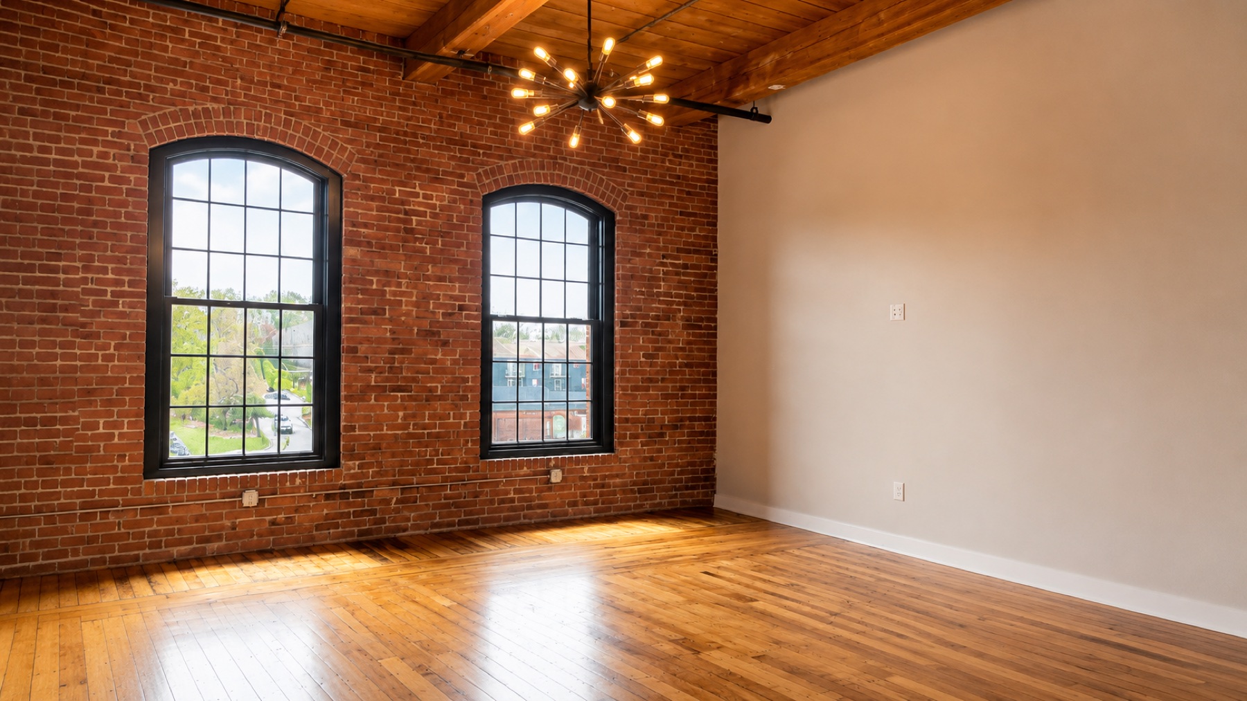 Restored brick wall and arched mill windows